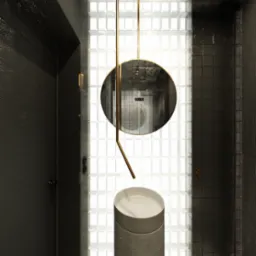 Nowoczesna łazienka z umywalką na postumencie, okrągłym lustrem zawieszonym na złotych prętach i ścianą z luksferów, czarne płytki na ścianach i mozaika na podłodze.