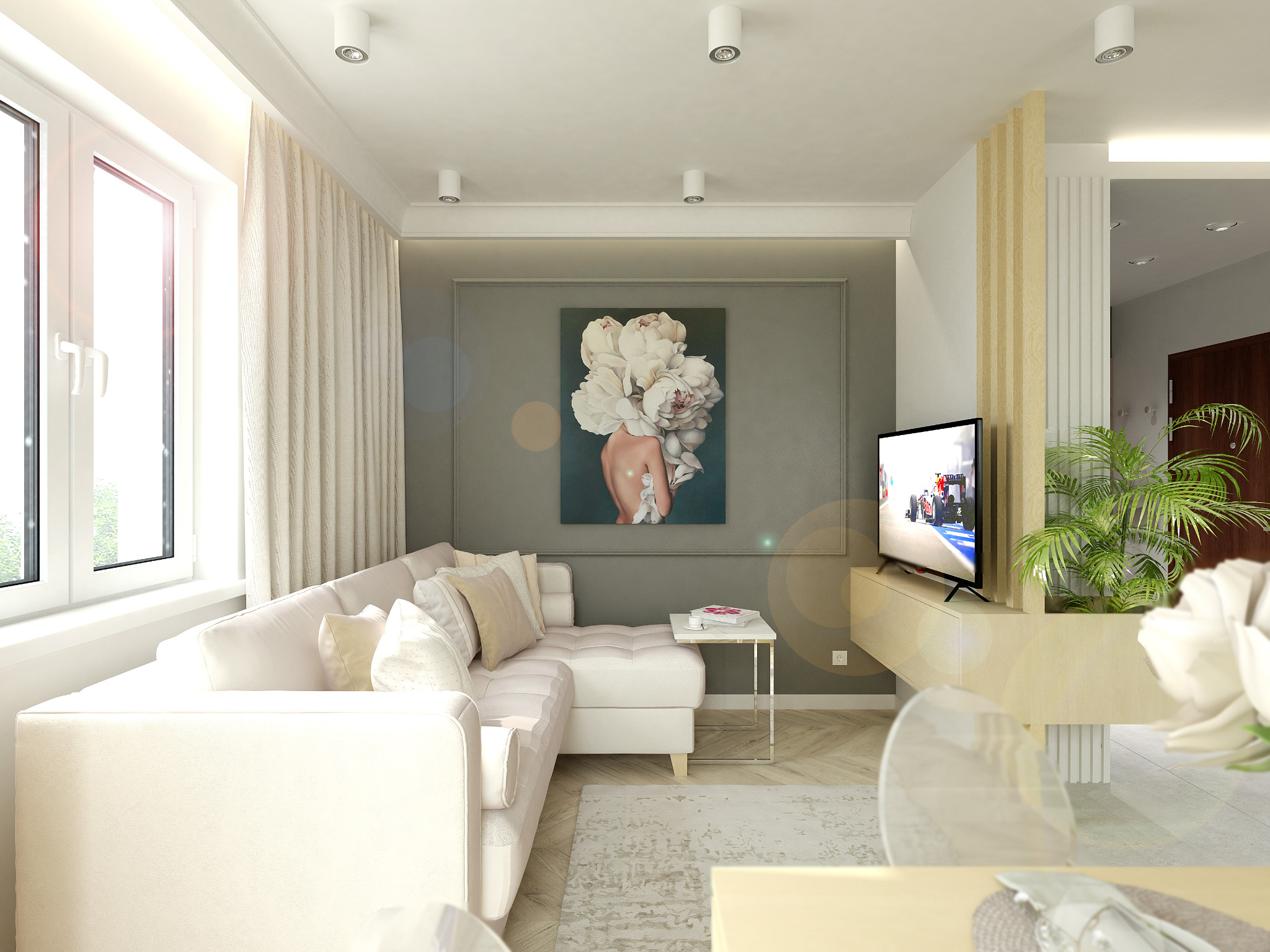Nowoczesny salon z narożną sofą w odcieniach bieli, obrazem z motywem kwiatowym i telewizorem na ścianie, podkreślony jasnym oświetleniem sufitowym.
