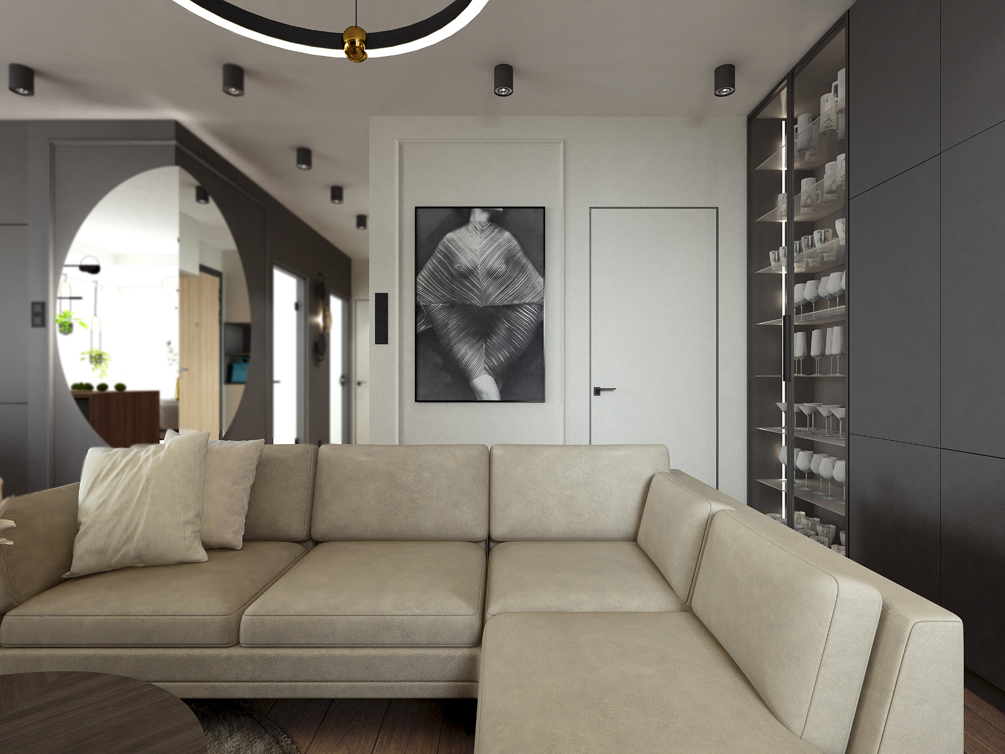 Salon w neutralnych barwach z narożną sofą, okrągłym stolikiem kawowym i minimalistyczną grafiką na ścianie, oświetlony punktowymi lampami sufitowymi i nowoczesną lampą wiszącą.