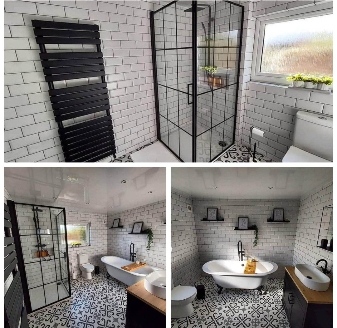 Nowoczesna łazienka z czarnymi akcentami: kabina prysznicowa z czarnymi profilami, grzejnik drabinkowy, wolnostojąca wanna na nóżkach, umywalka nablatowa na drewnianej szafce, białe płytki...