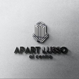 Mangraf Studio - Eleganckie logo 'Apart Lusso al centro' z motywem architektonicznym na teksturowanym, srebrnym tle.