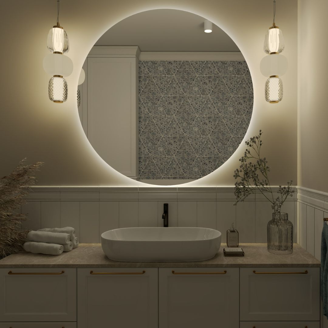 Nowoczesna łazienka z okrągłym lustrem podświetlanym LED, owalną umywalką nablatową i minimalistycznymi lampami wiszącymi.