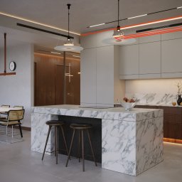 Agnieszka Szultk Szultk Architecture - Nowoczesna kuchnia z marmurową wyspą, drewnianymi szafkami i designerskim oświetleniem. Minimalistyczny stół z krzesłami w tle. Całość utrzymana w jasnej kolorystyce.