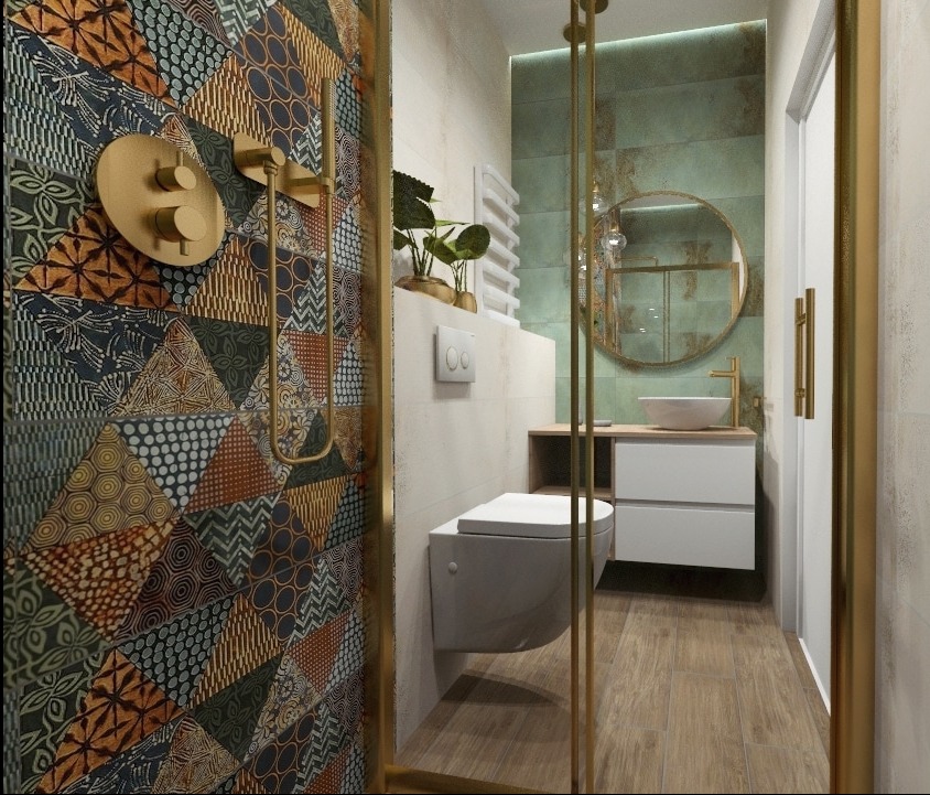 Nowoczesna łazienka z kabiną prysznicową, patchworkowe płytki na ścianie, okrągłe lustro i drewniana podłoga.