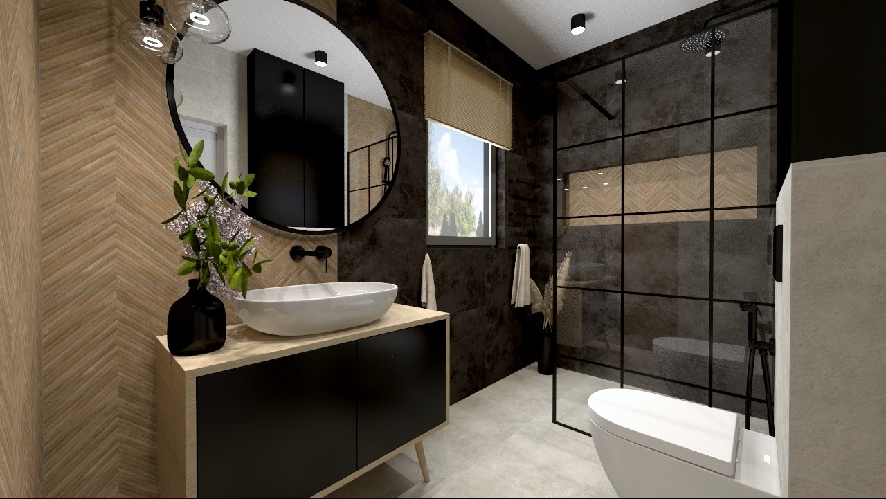 Nowoczesna łazienka z umywalką nablatową, kabiną prysznicową typu walk-in z czarnymi profilami i lustrem w okrągłej ramie, wykończona płytkami imitującymi drewno i ciemnym kamieniem.