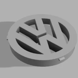 Szary, trójwymiarowy model zaślepki nawiewu w kształcie logo samochodowego na szarym tle, widok z góry pod kątem.