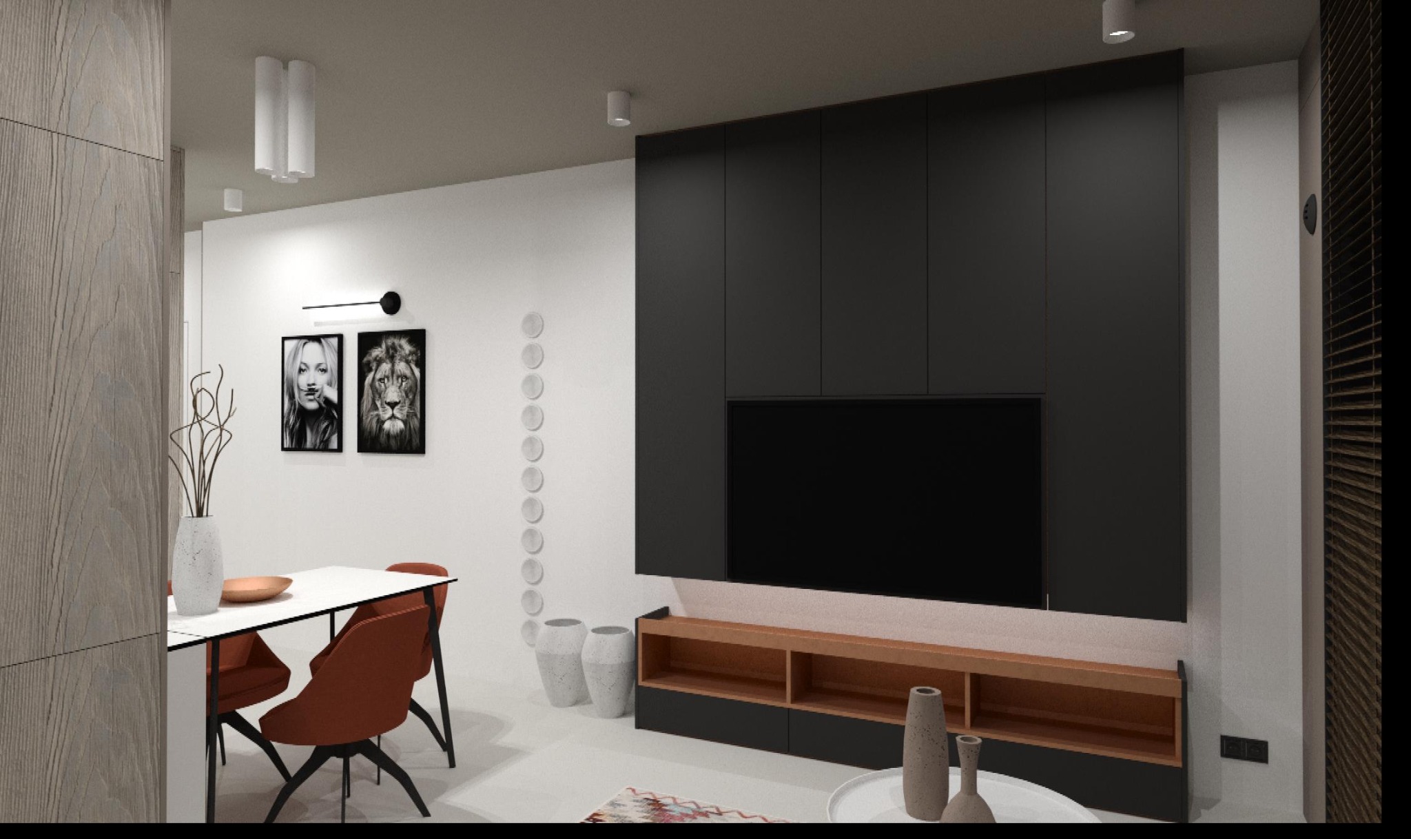 Nowoczesne wnętrze salonu z jadalnią: czarna zabudowa ściany TV, biały stół z pomarańczowymi krzesłami, grafiki Kate Moss i lwa na ścianie, dekoracyjne wazony, minimalistyczne oświetlenie.