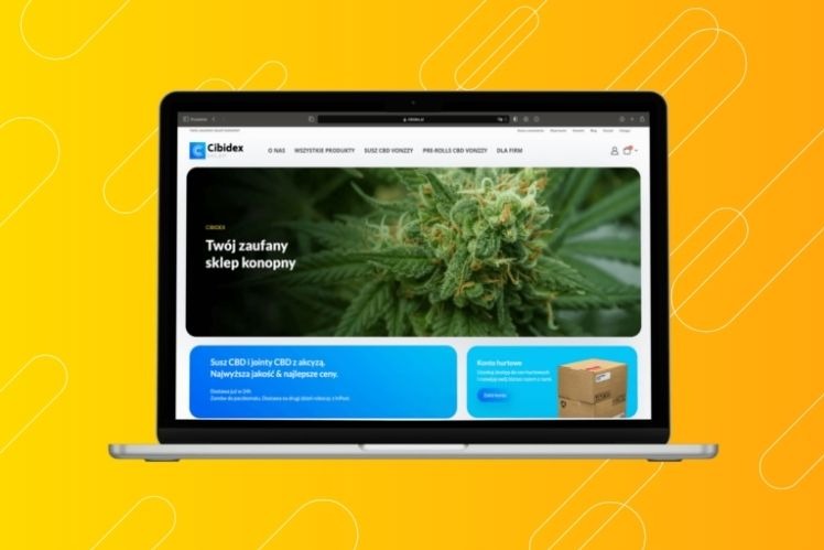 Laptop wyświetlający stronę internetową sklepu z produktami CBD, Cibdex, z widocznym zdjęciem kwiatu konopi i informacjami o suszu CBD i jointach z akcyzą, na żółtym tle.