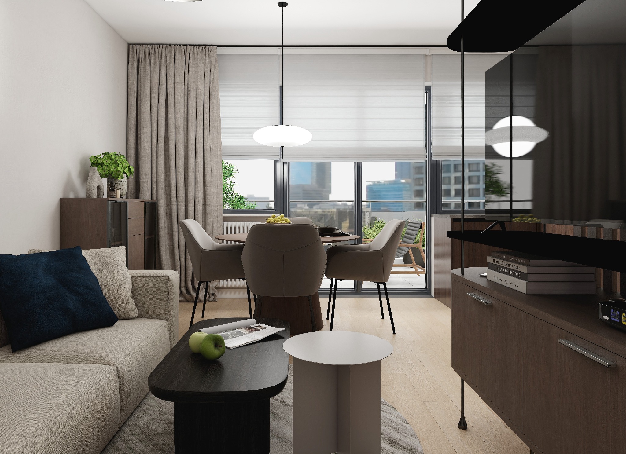 Jasne wnętrze z sofą z granatową poduszką, stolikiem kawowym z jabłkami i okrągłym stołem jadalnym z krzesłami. Za oknem widok na miasto.