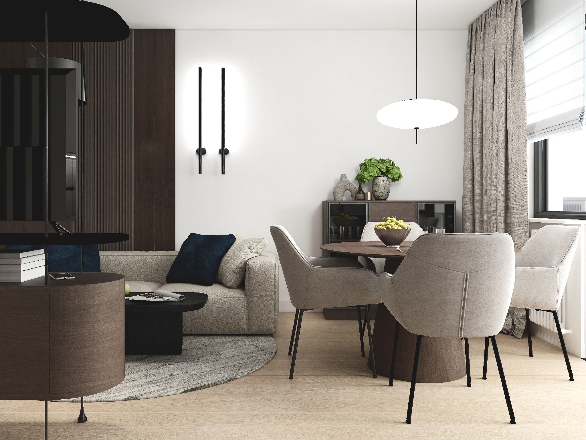 Nowoczesny salon z okrągłym stołem, krzesłami tapicerowanymi i beżową sofą z poduszkami. Minimalistyczne oświetlenie i dekoracje roślinne dopełniają aranżację.