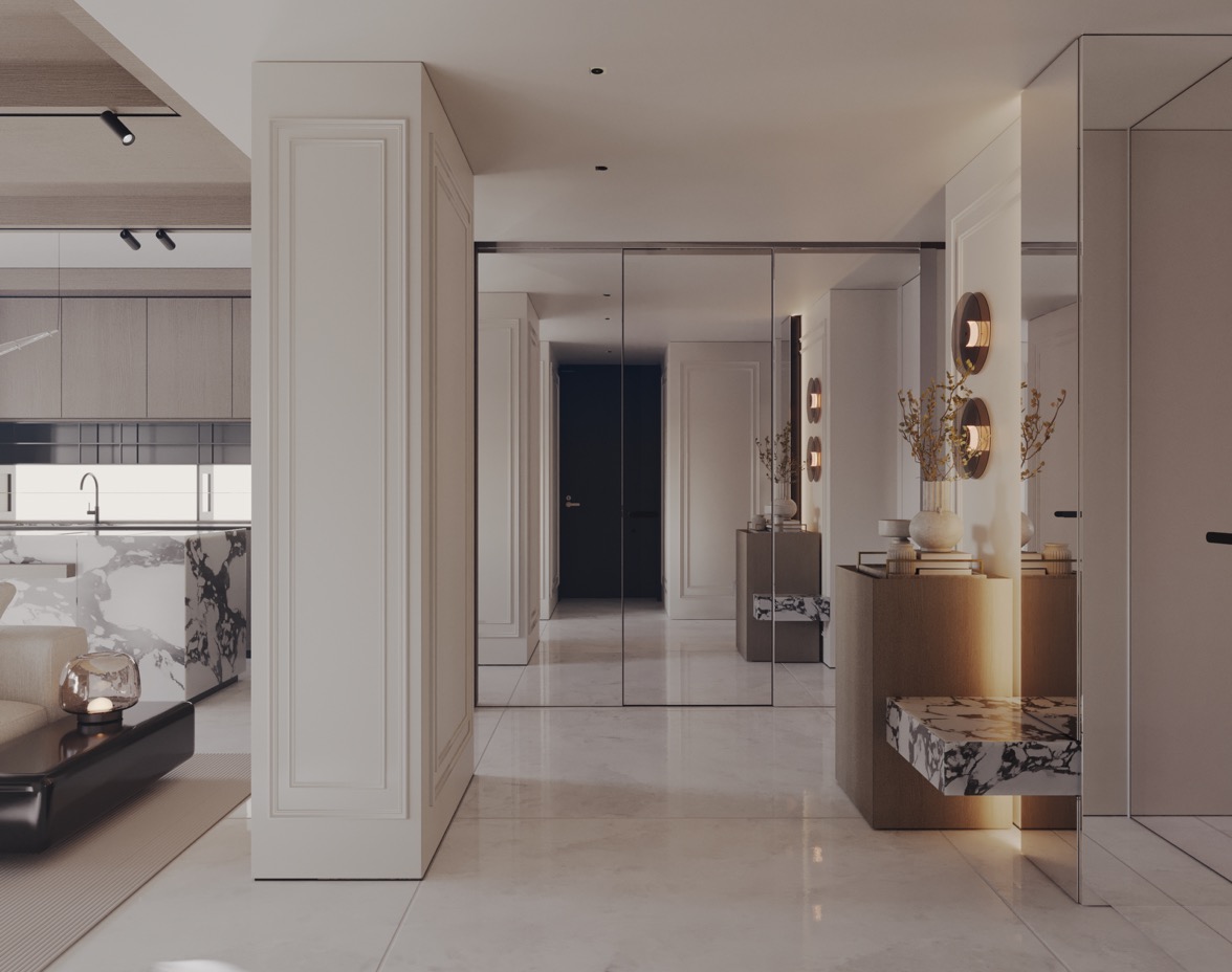 Elegancki przedpokój z lustrzanymi ścianami, marmurową posadzką i elementami dekoracyjnymi w odcieniach beżu i bieli, widok na otwartą kuchnię z wyspą.