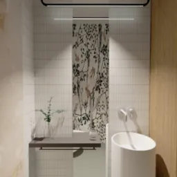 Wizualizacja łazienki z umywalką cylindryczną, ceramiczną armaturą, blatem z rośliną w szklanym wazonie, płytkami imitującymi tapetę z motywem ptaków i beżową ścianą z efektem marmuru.