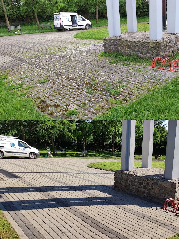 Częściowo wyczyszczona kostka brukowa na parkingu, widoczny biały samochód dostawczy z otwartymi drzwiami oraz fragment konstrukcji z kolumnami.