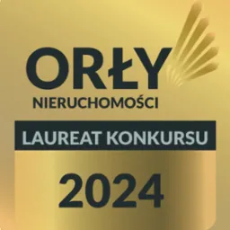 Złota plakietka z napisem 'Orły Nieruchomości', 'Laureat Konkursu' i rokiem 2024, symbolizująca nagrodę w branży nieruchomości.