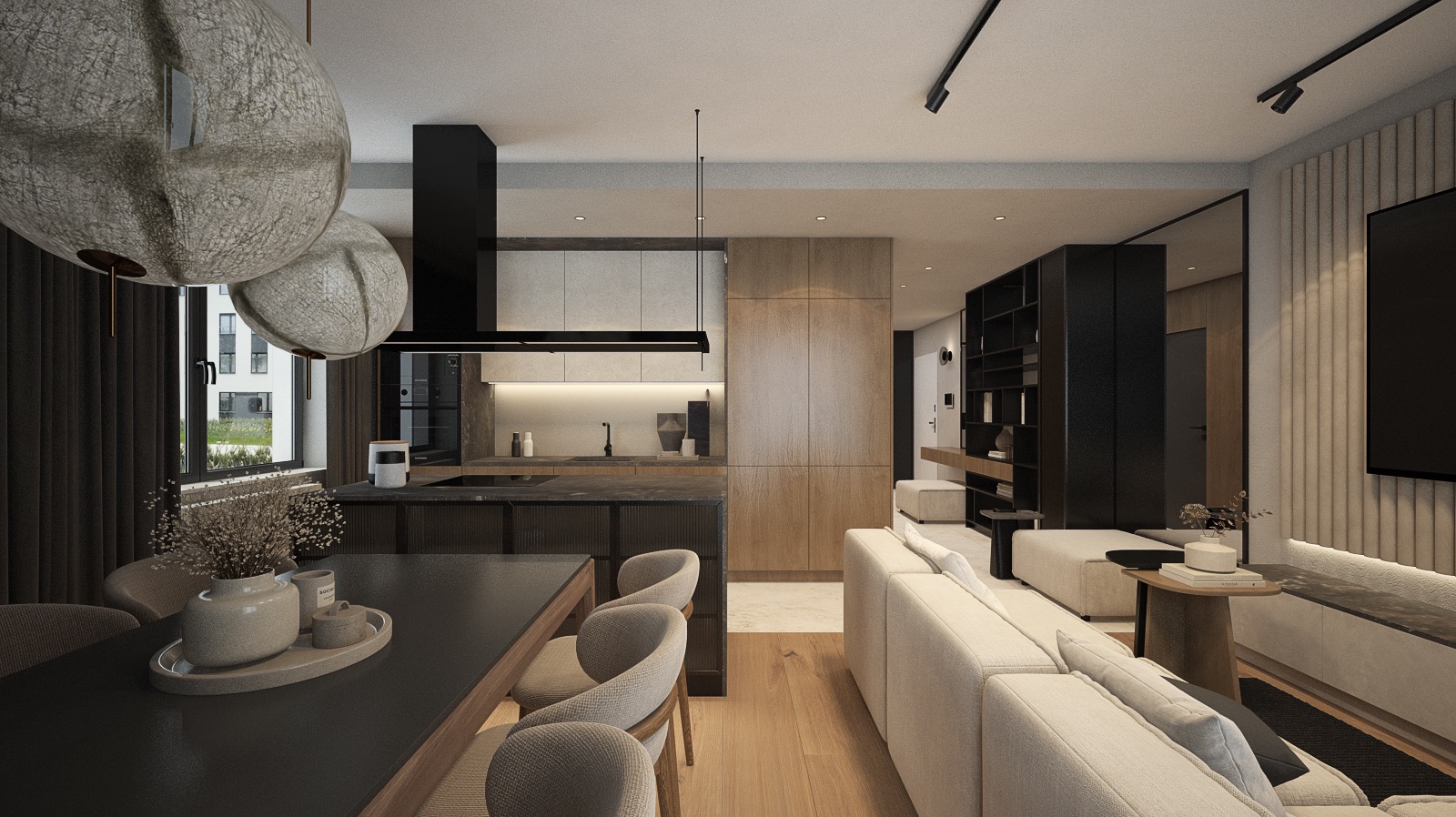 Wnętrze mieszkania w neutralnych barwach z otwartą kuchnią, jadalnią z ciemnym stołem i salonem z jasną sofą. Nad stołem wiszą dwie duże, dekoracyjne lampy. Widoczne okno z ciemnymi zasłonami...