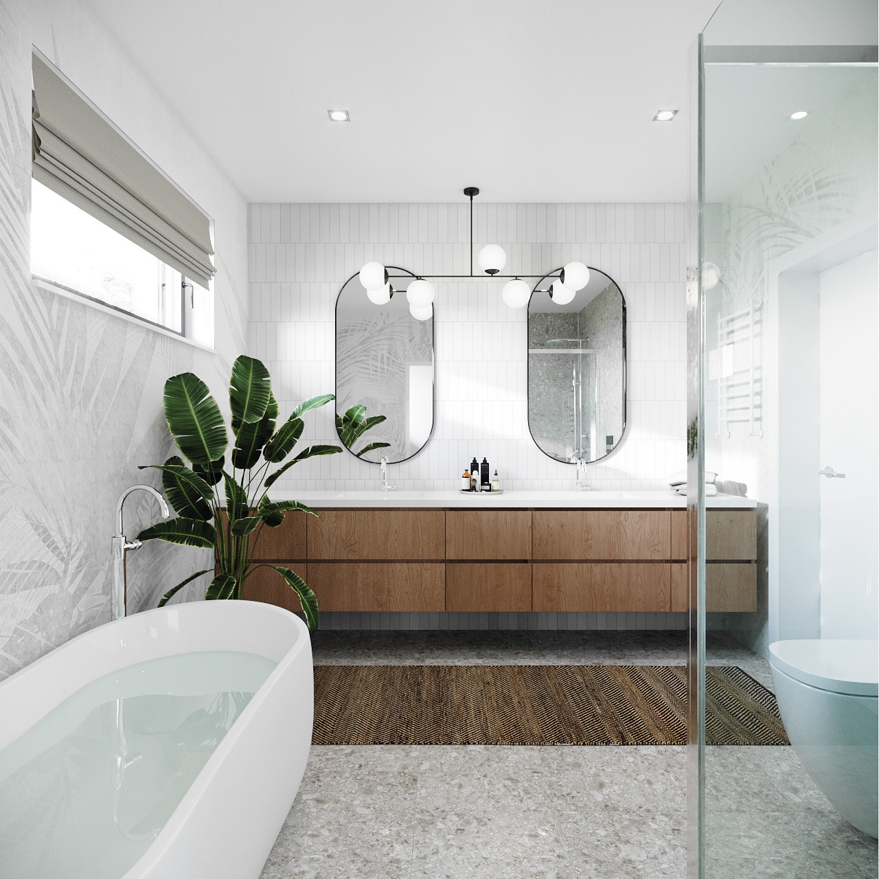 Jasna łazienka z wolnostojącą wanną, podwójną umywalką na drewnianej szafce, dwoma owalnymi lustrami, rośliną doniczkową i dywanikiem z plecionki.