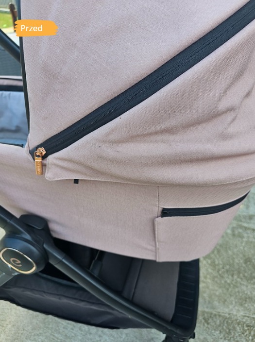 Fragment wózka dziecięcego z beżową tapicerką i widocznymi zabrudzeniami. Zdjęcie z napisem 'Przed' sugeruje stan przed czyszczeniem.