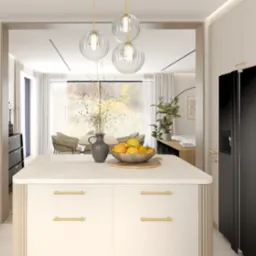 Jasna kuchnia z wyspą, złotymi uchwytami i czarnym sprzętem AGD Miele, widok na jadalnię z oknem na ogród.