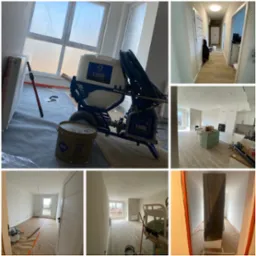 Wnętrze po szpachlowaniu, przygotowane do malowania. Widoczny agregat malarski Graco T-Max, wiadro z gładzią Atlas GTA, okna zabezpieczone folią.