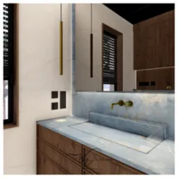 Nowoczesna łazienka z marmurowym blatem i wpuszczaną umywalką, minimalistyczna złota bateria ścienna, podświetlane lustro i drewniane szafki z szufladami oraz designerskie lampy wiszące.