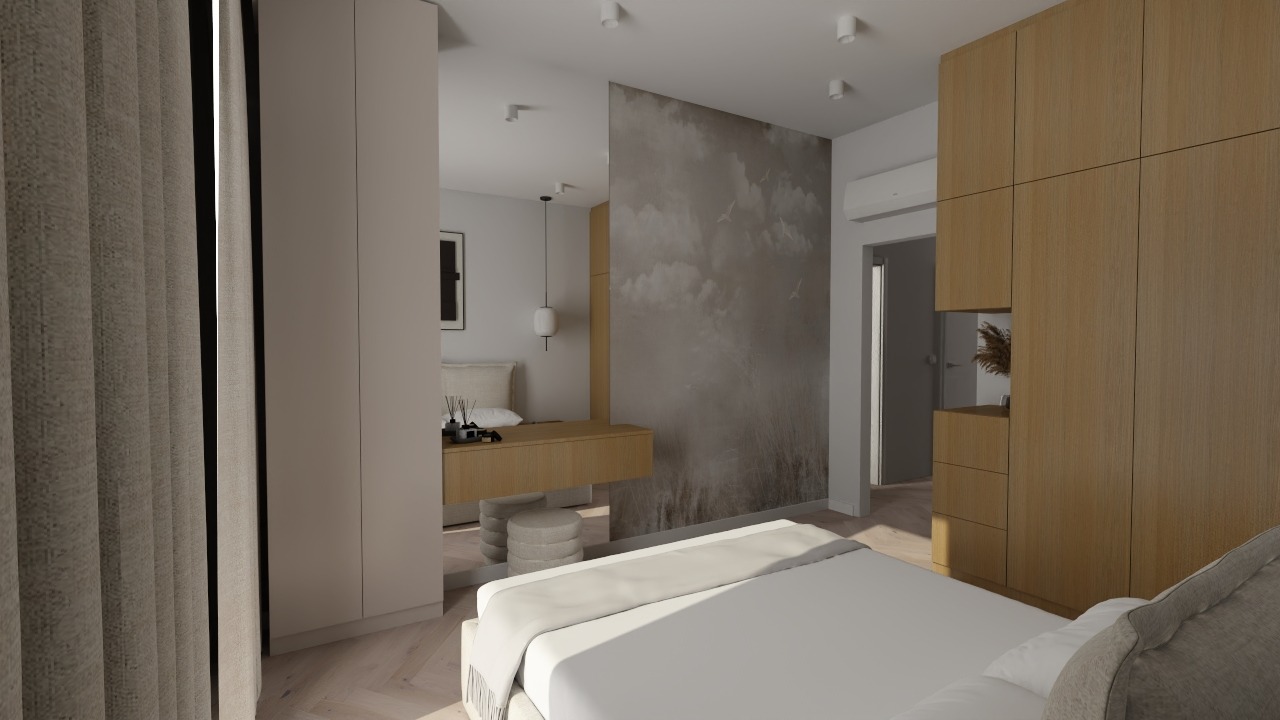 Jasna sypialnia z łóżkiem, toaletką i szafą w zabudowie. Na ścianie tapeta z motywem łąki i ptaków. Minimalistyczny design, ciepłe oświetlenie, parkiet w jodełkę.