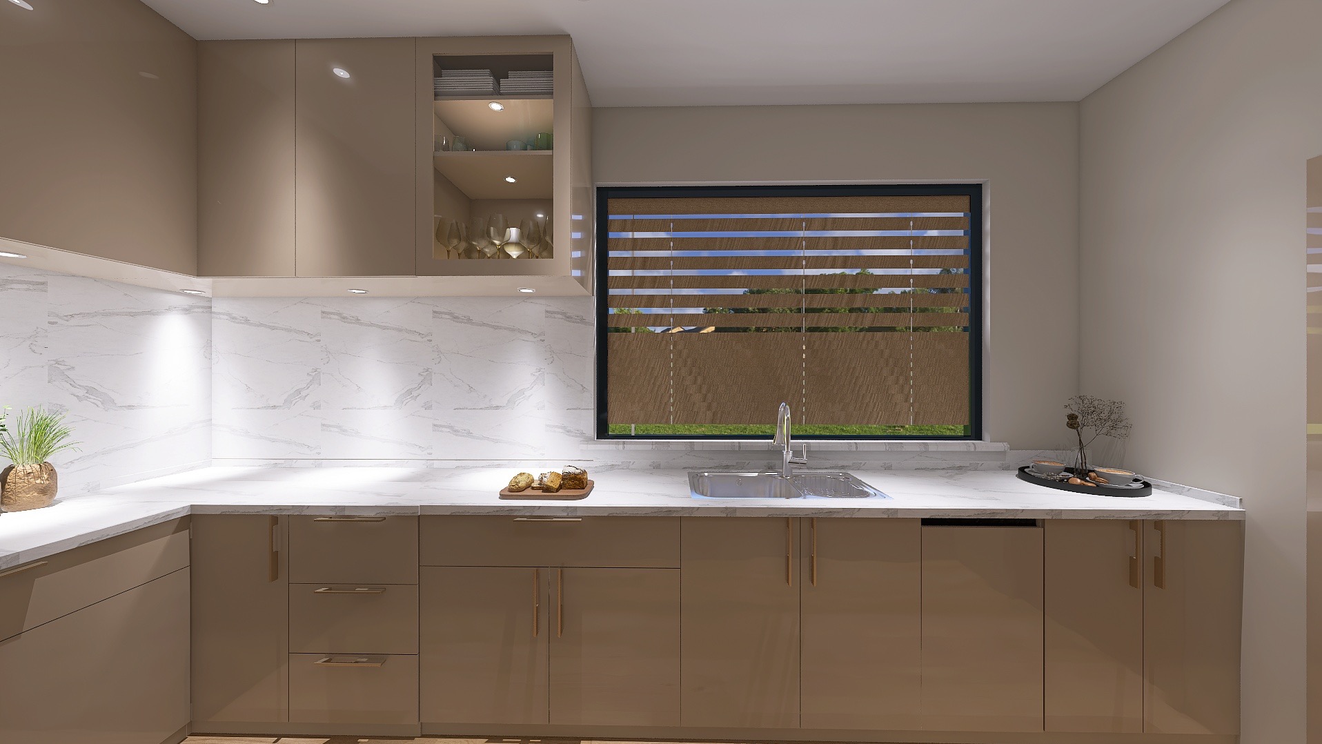 Beżowa kuchnia w nowoczesnym stylu z marmurowym blatem i oknem z roletami. Na blacie dekoracje i jedzenie. Widok na zabudowę kuchenną i okno.