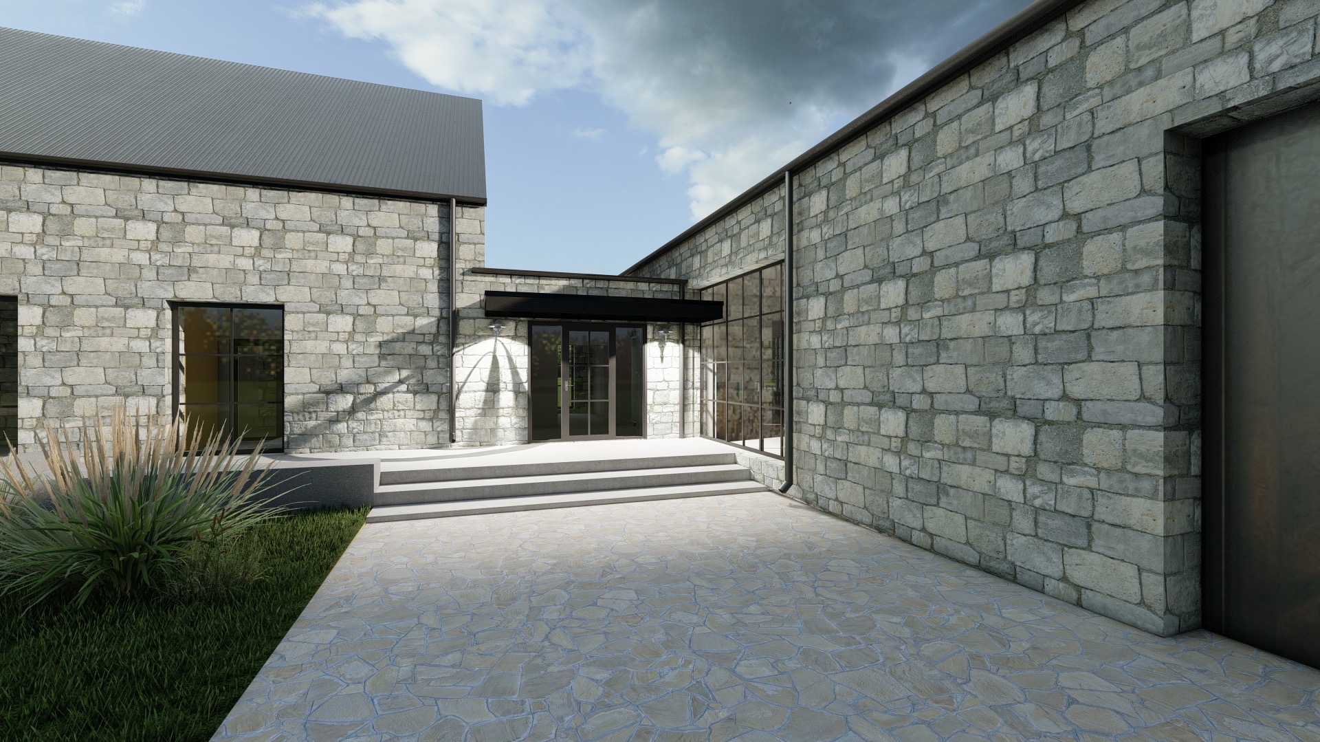 Nowoczesny dom z elewacją z kamienia, szarym dachem i wejściem zadaszonym czarnym baldachimem, widok z kamiennego dziedzińca.