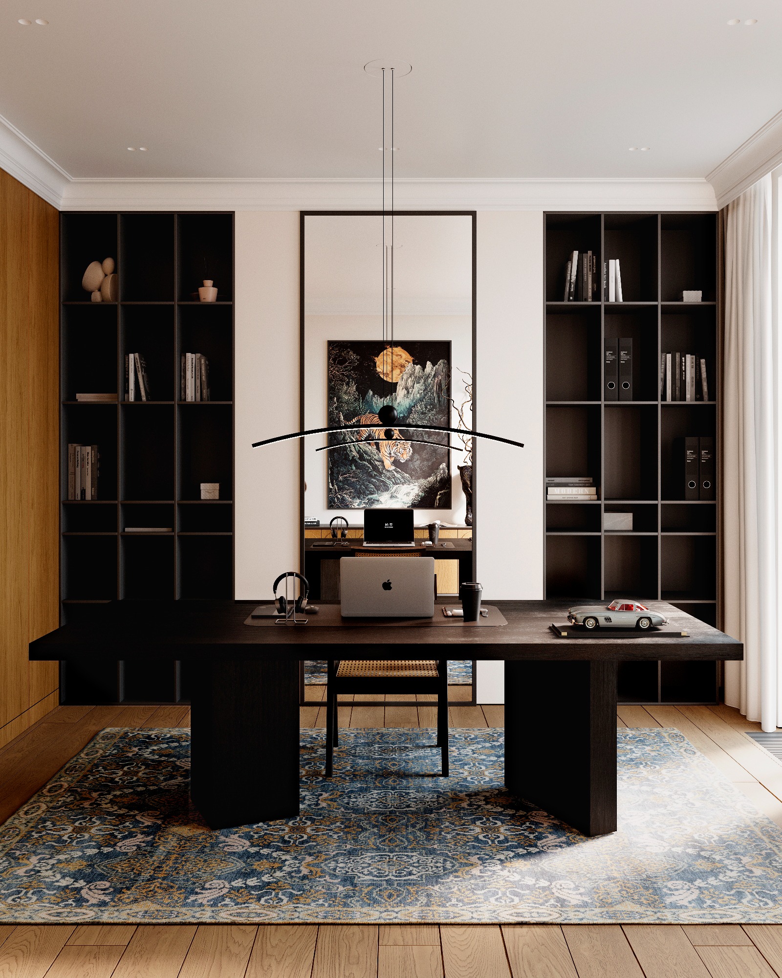 Eleganckie biuro domowe z czarnym biurkiem, laptopem, słuchawkami, modelem samochodu i wzorzystym dywanem na drewnianej podłodze, oświetlone nowoczesną lampą wiszącą, z półkami na książki i obrazem...