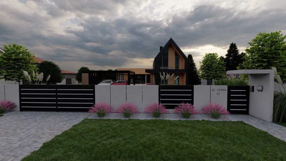 Nowoczesna posesja w Wierzbiczanach z minimalistycznym ogrodzeniem, rabatami z różowymi kwiatami i trawnikiem na pierwszym planie, w tle dom z drewnianą elewacją i garażem na dwa samochody.