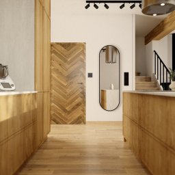 BARLOW SPÓŁKA Z OGRANICZONĄ ODPOWIEDZIALNOŚCIĄ - Nowoczesna kuchnia z drewnianymi szafkami, parkietem w jodełkę na drzwiach i podłodze, minimalistycznym lustrem oraz schodami w tle.