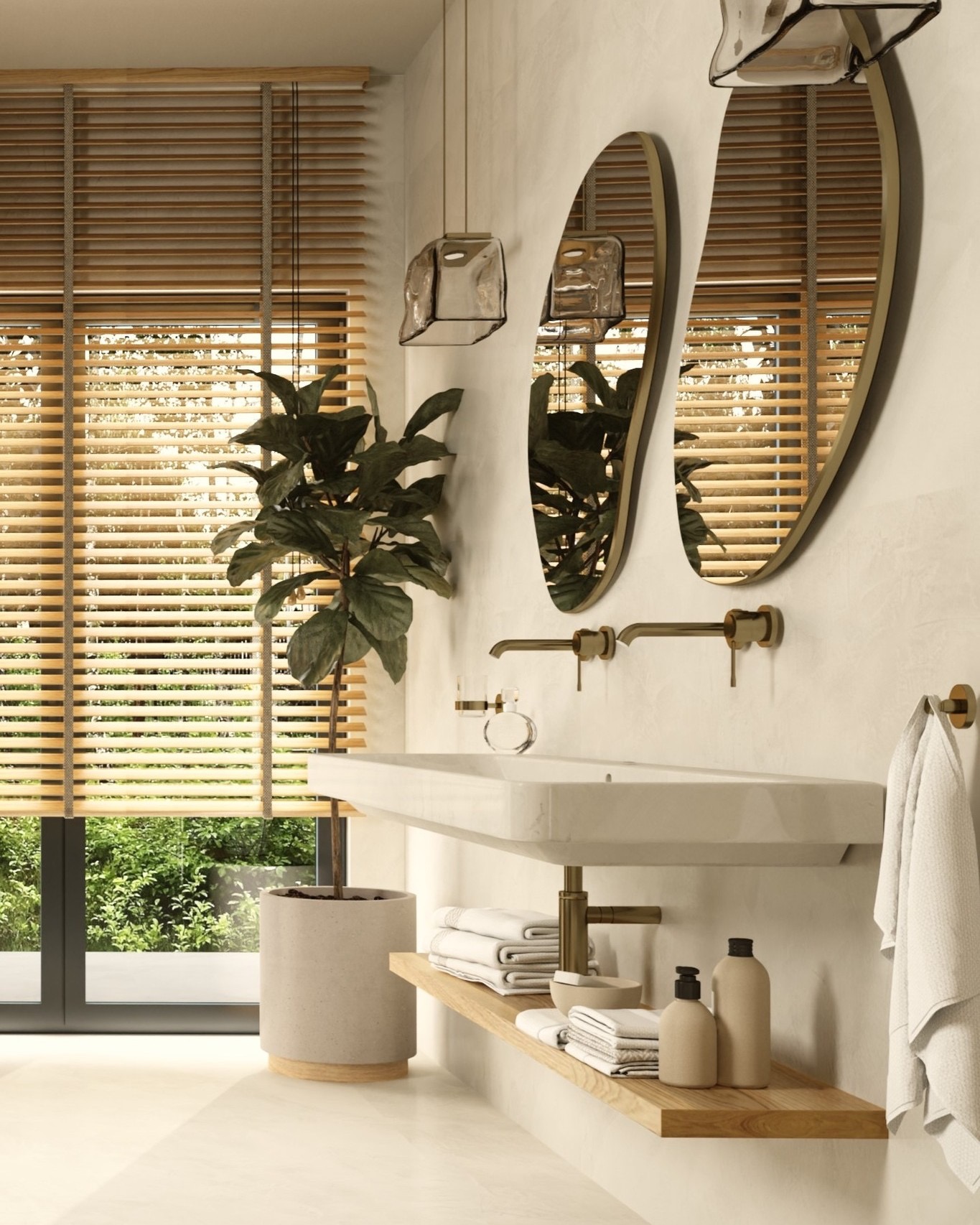 Nowoczesna łazienka z owalnymi lustrami w złotych ramach, minimalistyczną białą umywalką, drewnianymi żaluzjami w oknie i rośliną doniczkową, oświetlona przez szklaną lampę wiszącą.
