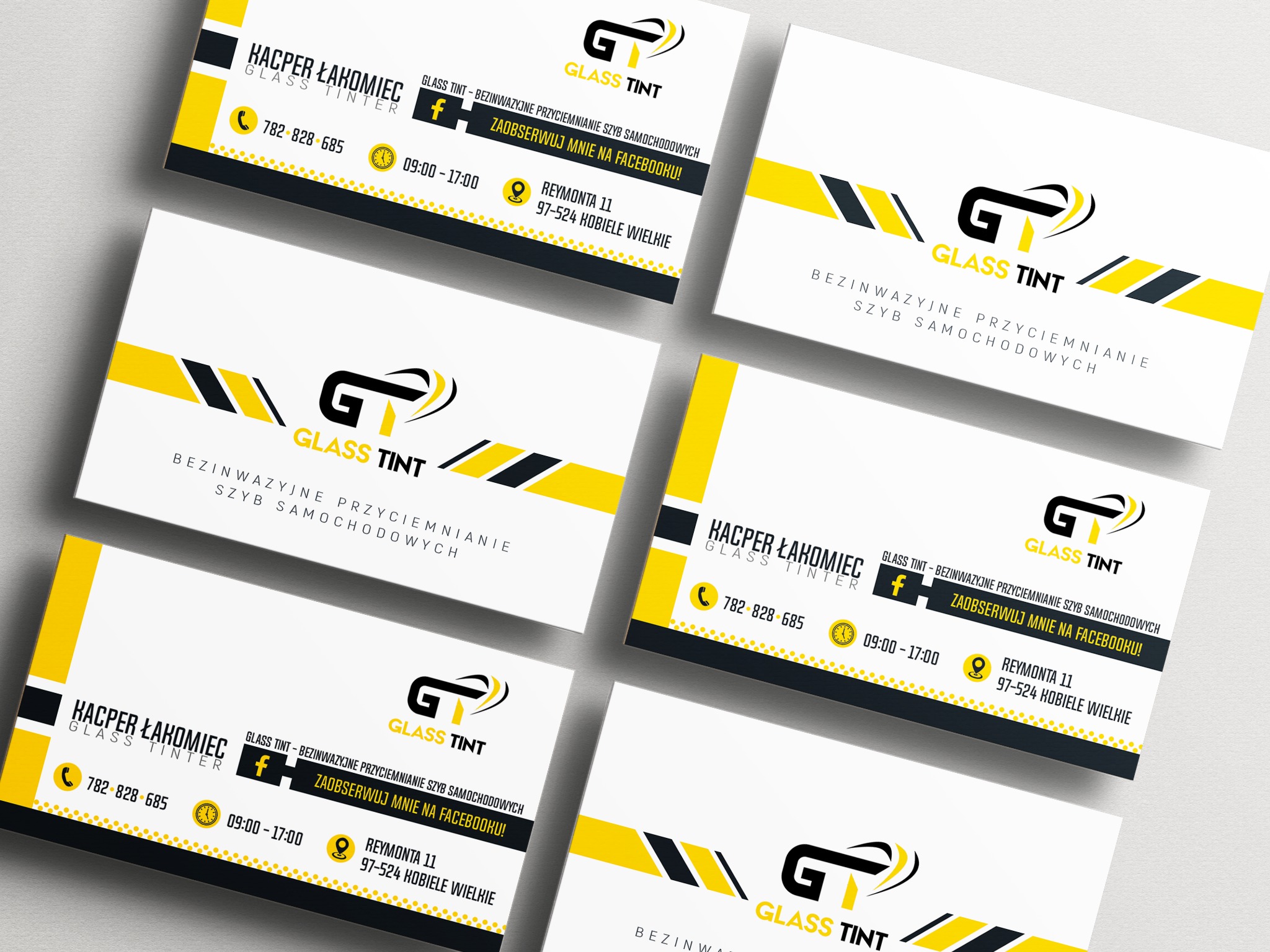Wizytówki firmy Glass Tint z logo w kolorach czarnym i żółtym, prezentujące dane kontaktowe, adres i informację o przyciemnianiu szyb samochodowych.