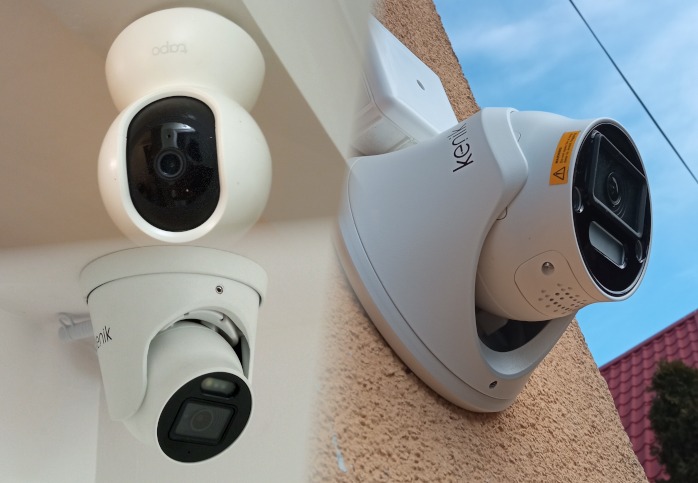 Trzy białe kamery monitoringu różnych modeli: dwie wewnętrzne na suficie i jedna zewnętrzna zamontowana na elewacji budynku, z widocznym ostrzeżeniem na obudowie.