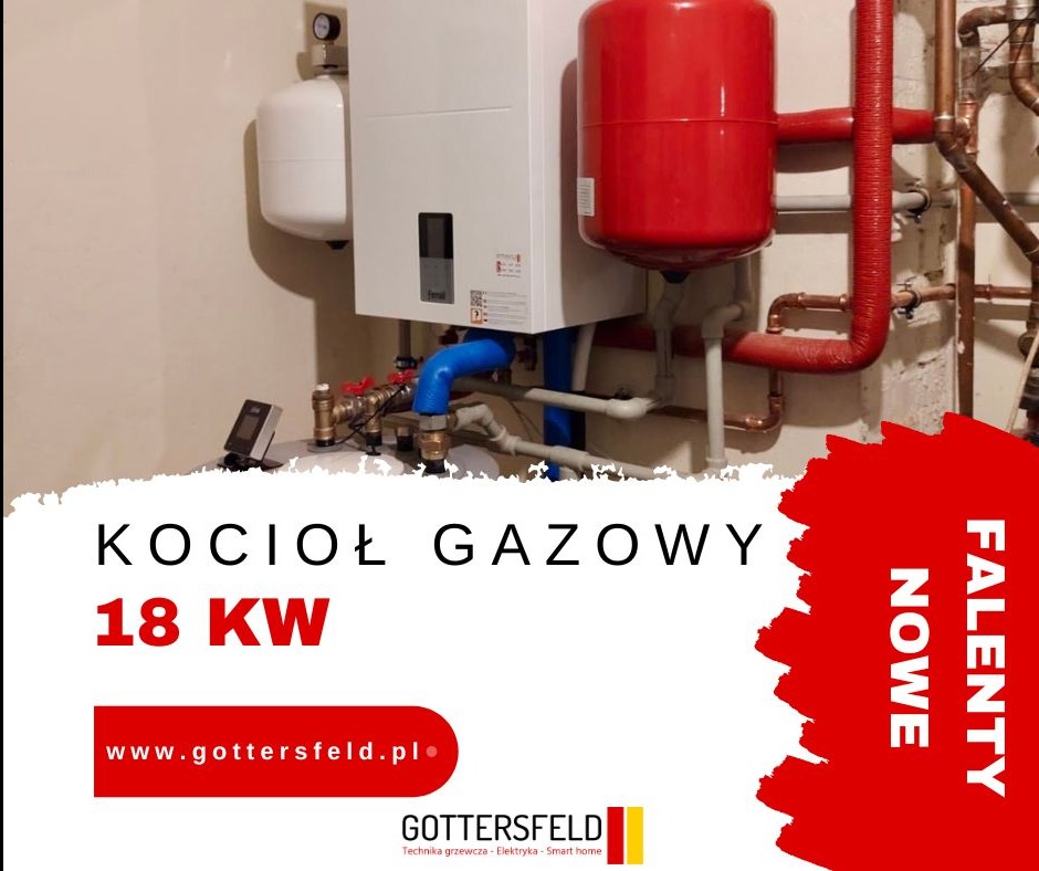 Kocioł gazowy z podłączonymi rurami miedzianymi i zbiornikiem wyrównawczym, widoczny manometr i elementy instalacji grzewczej w pomieszczeniu technicznym. Na pierwszym planie widoczny fragment...