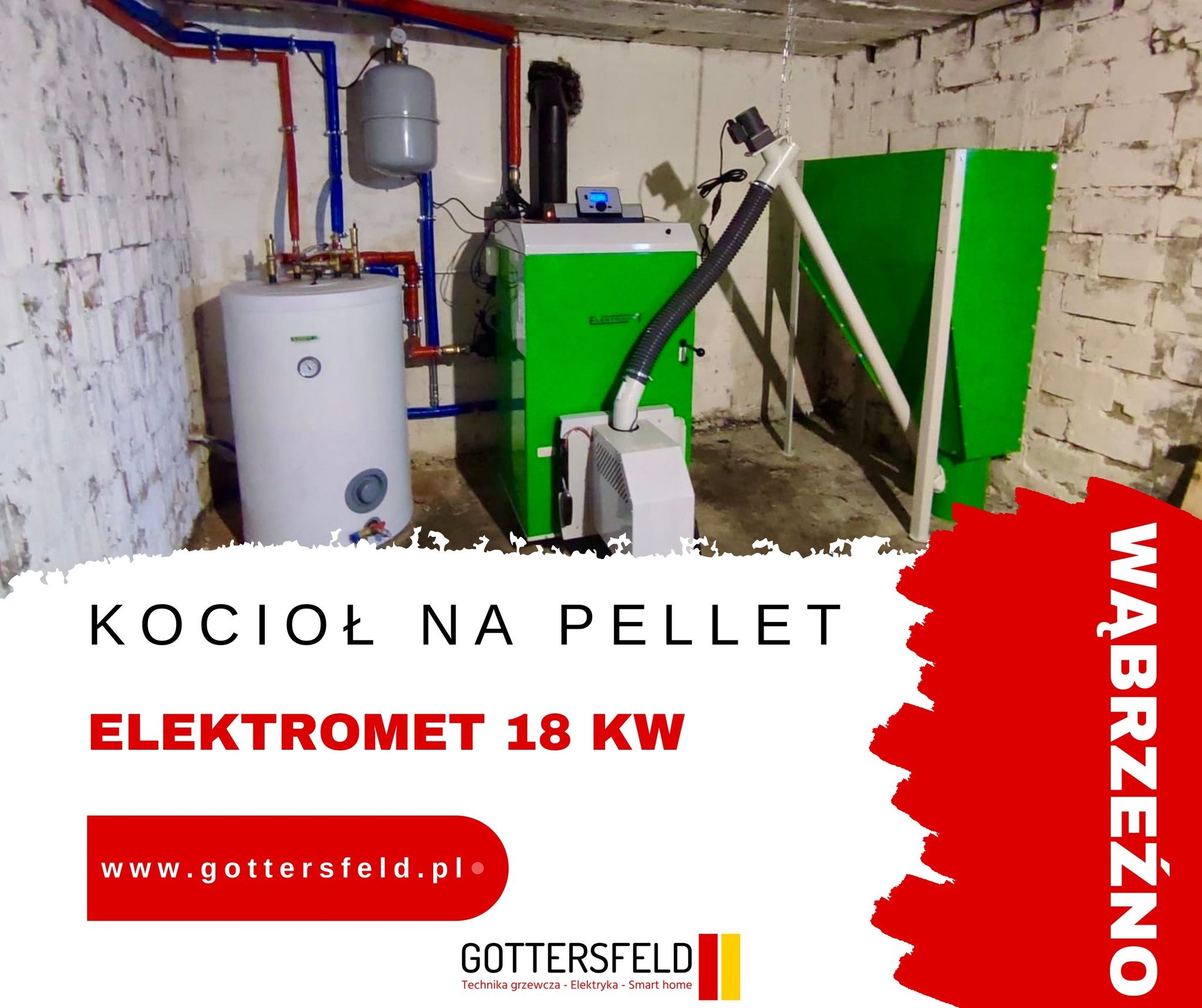 Kotłownia z kotłem na pellet Elektromet 18 kW, z widocznymi rurami instalacji grzewczej, zbiornikiem wyrównawczym i podajnikiem paliwa, zamontowana w piwnicy z surowymi ścianami.
