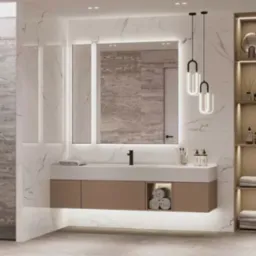 Nowoczesna łazienka z marmurowymi płytkami, podświetlanym lustrem i szafką pod umywalką. Kabina prysznicowa ze szklanymi drzwiami i dekoracyjne oświetlenie.