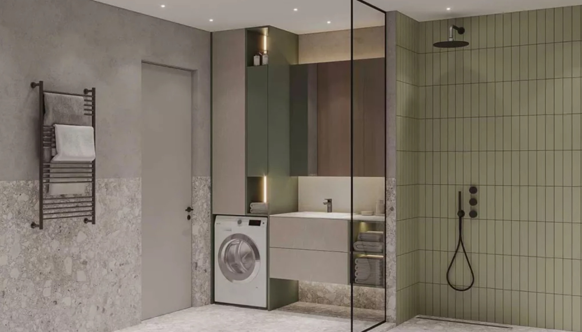 Nowoczesna łazienka z pralką w zabudowie, kabiną prysznicową za szklaną ścianką i grzejnikiem drabinkowym na tle ściany z szarym lastryko.