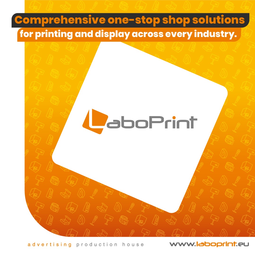 Grafika reklamowa z logo LaboPrint na białym, ukośnym tle, otoczonym pomarańczowym wzorem z ikonami związanymi z drukiem i reklamą, hasłem o kompleksowych rozwiązaniach i adresem strony internetowej.