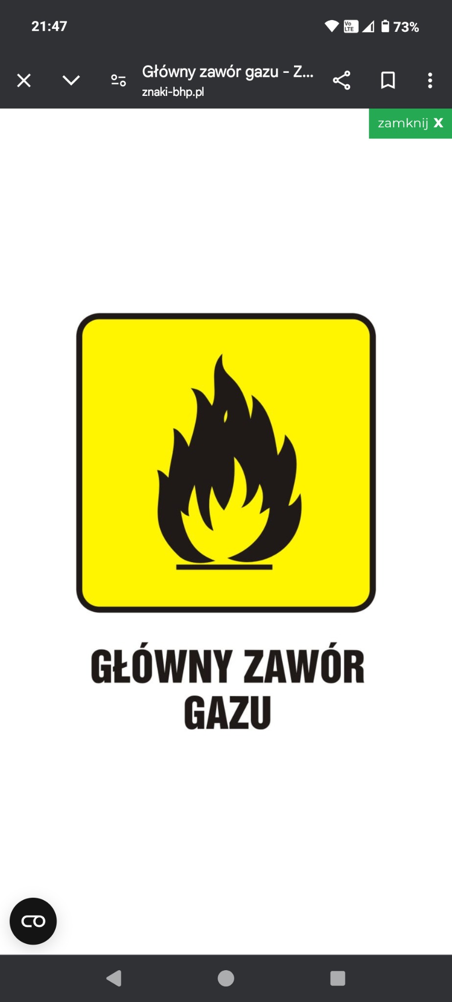 Żółta tabliczka ostrzegawcza z symbolem płomienia i napisem 'Główny zawór gazu' w kolorze czarnym. Ostrzeżenie o lokalizacji głównego zaworu.