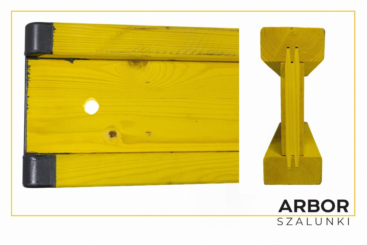 Żółta drewniana belka szalunkowa z czarnymi plastikowymi zabezpieczeniami na krawędziach, widok z boku i przekrój poprzeczny, logo producenta w prawym dolnym rogu.