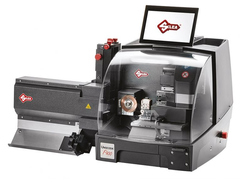 Profesjonalna, elektroniczna maszyna do dorabiania kluczy Unocode F900 z przezroczystą osłoną i ekranem LCD prezentującym logo producenta.