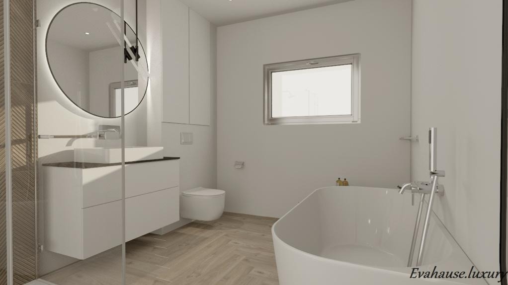 Jasne wnętrze łazienki z owalnym lustrem z podświetleniem LED, białą umywalką nablatową na szafce z szufladami, wolnostojącą wanną i podłogą z parkietu ułożonego w jodełkę.