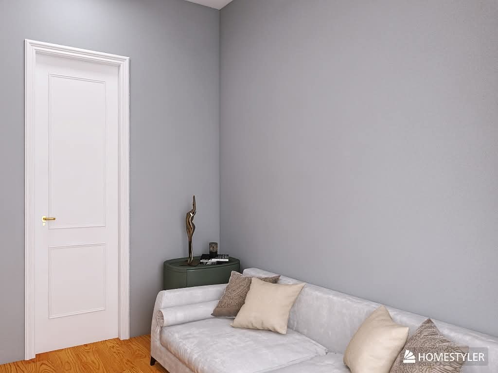 Białe, panelowe drzwi z złotą klamką w szarej aranżacji wnętrza z sofą, stolikiem i dekoracyjną figurką. Neutralna kolorystyka, minimalistyczny design.