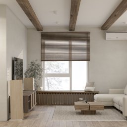 AWÓ. STUDIO PROJEKTOWE ANNA WÓJCIK - Jasne wnętrze salonu z drewnianymi belkami stropowymi, roletami w oknie i narożną sofą w neutralnych barwach.