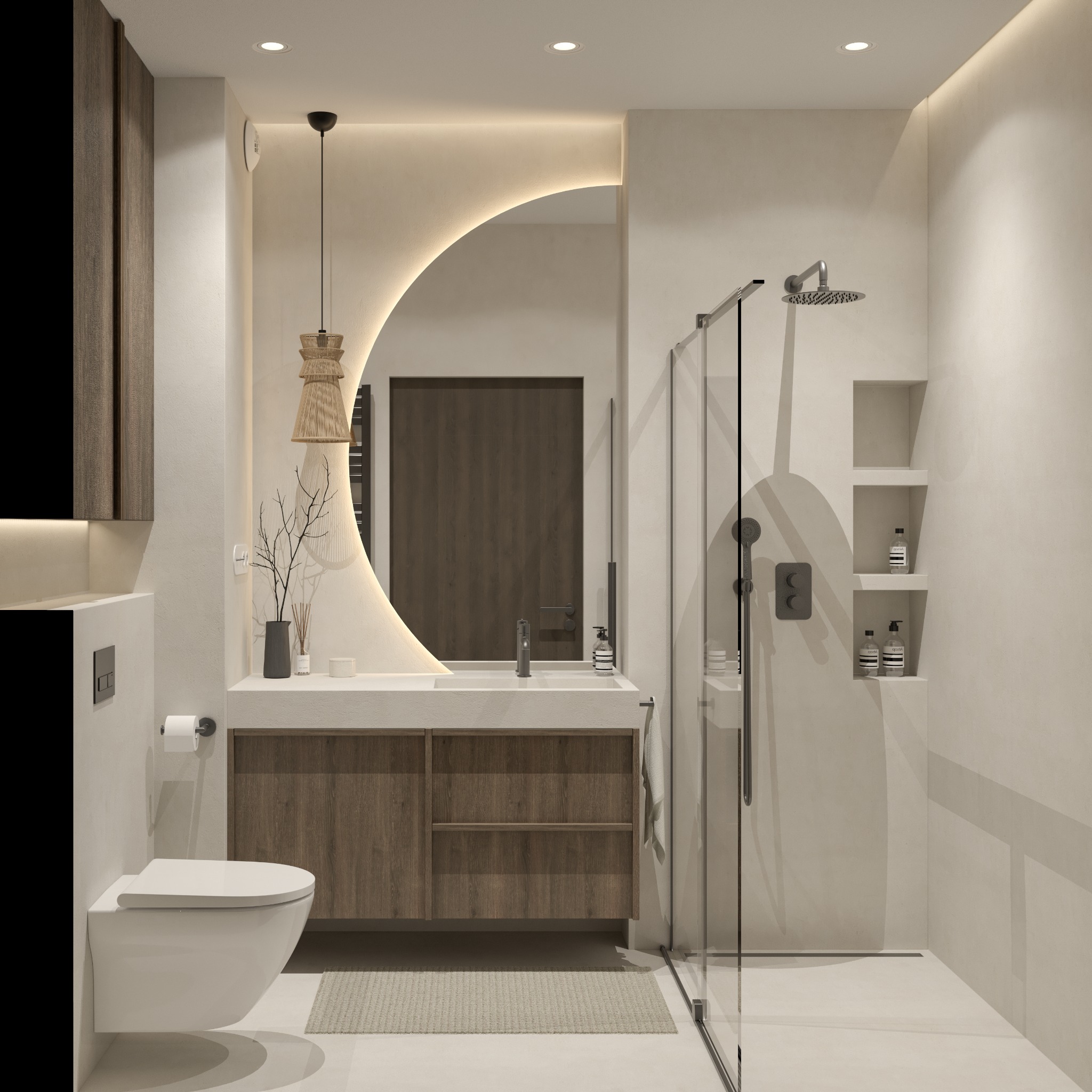 Nowoczesna łazienka z podświetlanym, półokrągłym lustrem, drewnianą szafką pod umywalką, kabiną prysznicową ze szklanymi drzwiami i wiszącą toaletą. Elementy dekoracyjne: lampa wisząca...