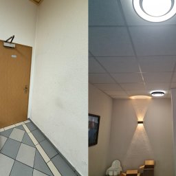 DoMpro- Remonty I Wykończenia wnętrz - Fragment wnętrza biurowego z widoczną częścią uszkodzonej sofy, drzwiami z samozamykaczem i dekoracyjnym oświetleniem ściennym oraz kasetonowym sufitem.