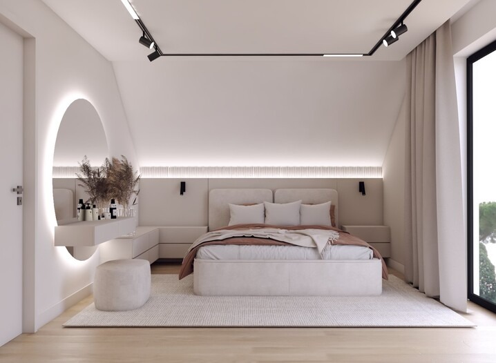Jasna sypialnia w minimalistycznym stylu z owalnym lustrem z podświetleniem LED, beżowym łóżkiem i dywanem, oświetleniem szynowym na suficie.