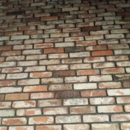 Tekstura ściany z cegły klinkierowej w odcieniach bieli, pomarańczy i brązu, z widocznymi fugami, imitująca starą cegłę.