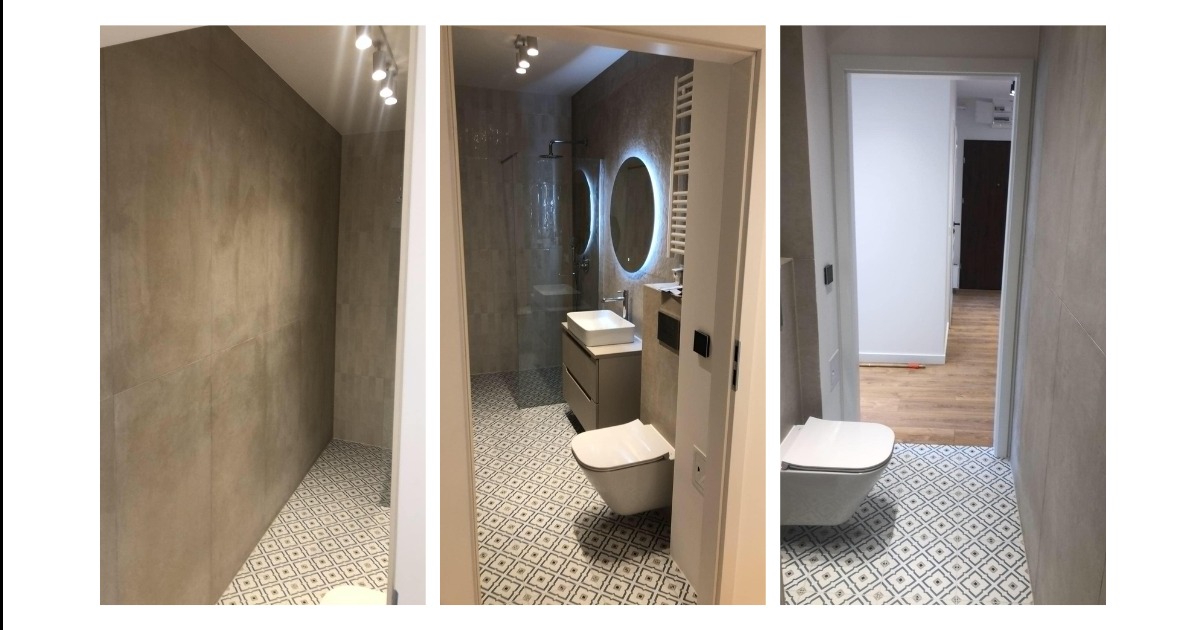 Wnętrze łazienki z widokiem na kabinę prysznicową, umywalkę z szafką i toaletę. Na podłodze wzorzyste płytki, na ścianach szare płytki imitujące beton. Lustro z podświetleniem LED. Widok z trzech...