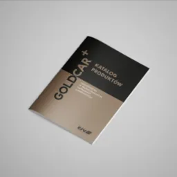 Katalog produktów Goldcar+ na beżowo-czarnym tle, leżący ukośnie na jasnoszarym tle.